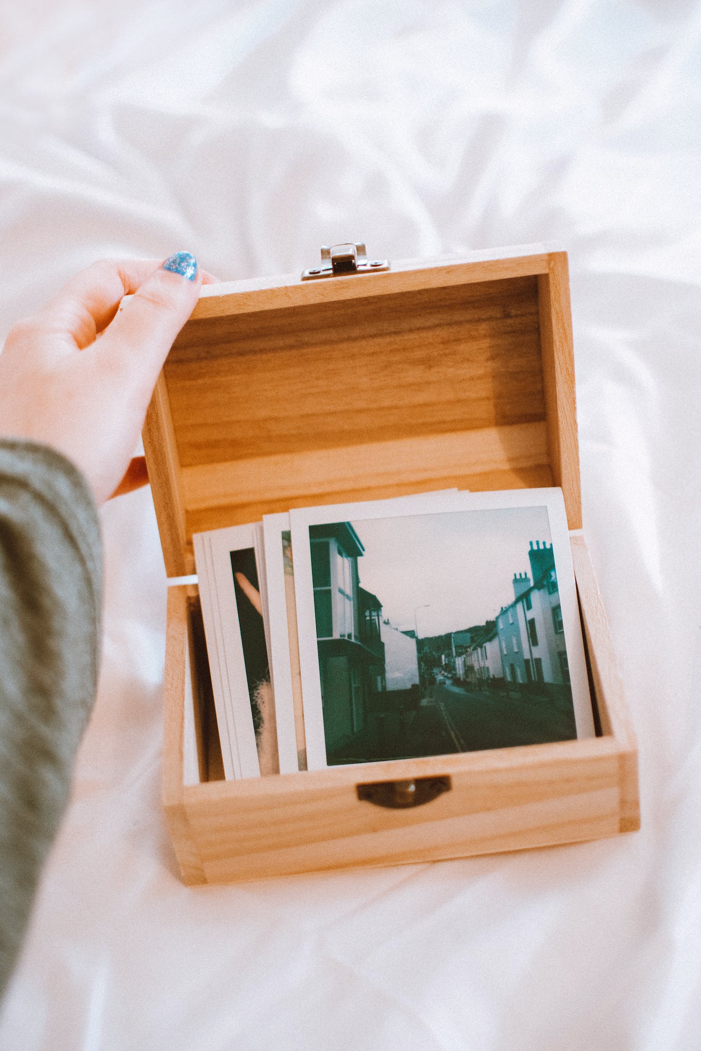 A wooden box full of images